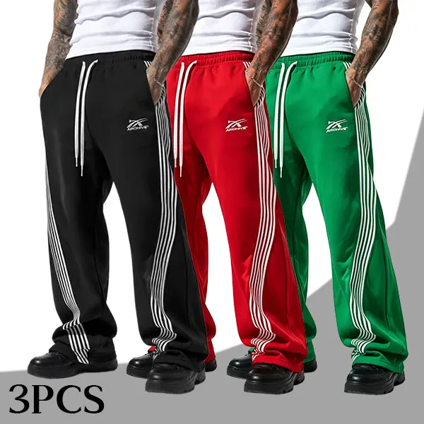 Men’s three-pack joggers, American streetwear brand style, embroidered logo, side stripes, wide-leg pants, unisex design, elastic waistband, fluid drape, versatile trendy floor-length sweatpants