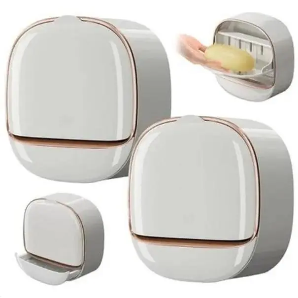 Modern wall-mounted soap dish with rose gold trim, white, plastic construction, and bathroom drainage design.(Includes snap-on adhesive strip)