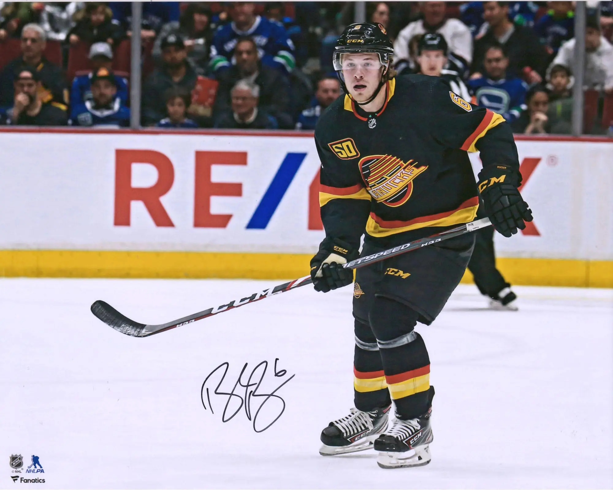 Brock Boeser Vancouver Canucks Autographed 16" x 20" Black Jersey Skating Photograph - Fanatics Authentic Certified