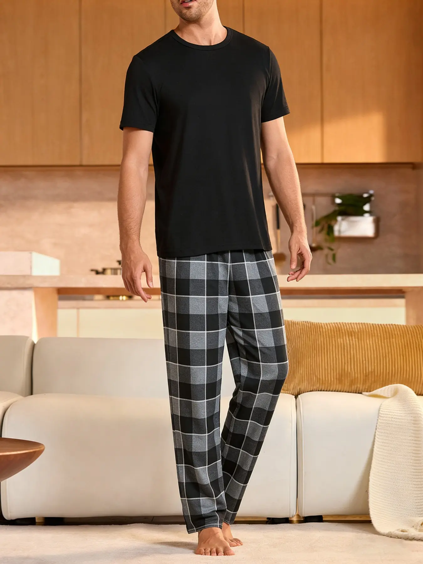 2-piece men's plain black short sleeved top with coarse plaid gray bottom pants, soft and comfortable round neck design, elastic waistband, suitable for all seasons home daily casual men's pajamas sleepwear set