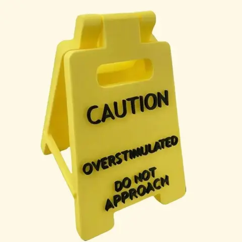 Caution Overstimulated Desk Sign - Yellow Sign with Black Text,  Humor Gag Gift for Coworkers, Boss & Employees, Mini Novelty Funny Desk Decor