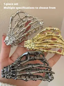 A skull Goddess Hair Clip in the shape of a skull hand. A sturdy metal structure that tightly grips the hair. Avant garde Gothic style, suitable for festivals, daily dressing up, and Halloween. A cool gift for alternative fashion enthusiasts! Hair Claws