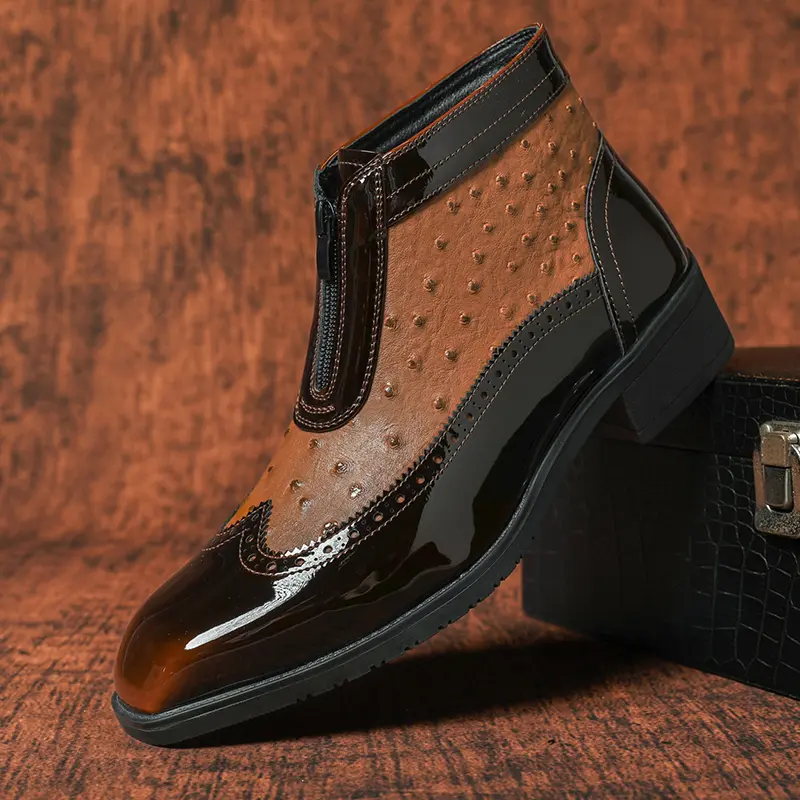 Men's Chelsea boots in a British vintage style, featuring embossed color-block detailing, side zipper, and a short, unlined shaft.