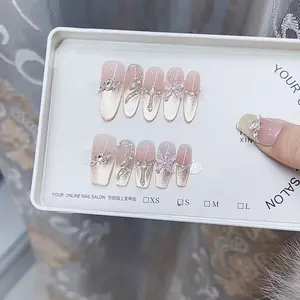 HANDMADEPRESSONNAILSCATEYESNAILSLONGNAILS with Elegant Rhinestone Accents and Soft Pink Finish for Stylish Nail Looks