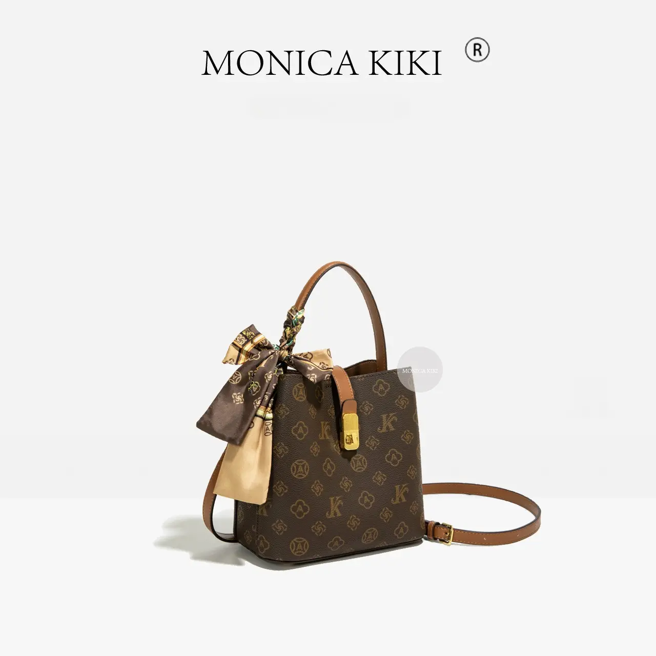 Vintage-style monogram crossbody bag; stylish, versatile bucket bag; premium-feel commuter shoulder bag