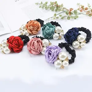 A Three-Piece Set of Pearl Flower Hair Ties for Stylish Rubber Bands for Ponytails, And Fashionable Hair Additions