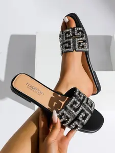 Women's fashionable rhinestone sandals, embellished with crystals, comfortable wide slip-on style, flat design, perfect for casual summer wear.