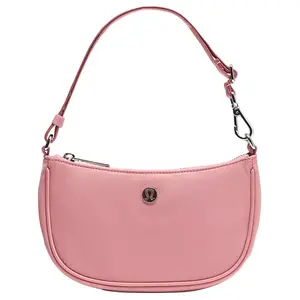 Lululemon City Essentials Mini Crossbody Bag with Adjustable Strap and Zipper Closure in Pink Nylon for Women