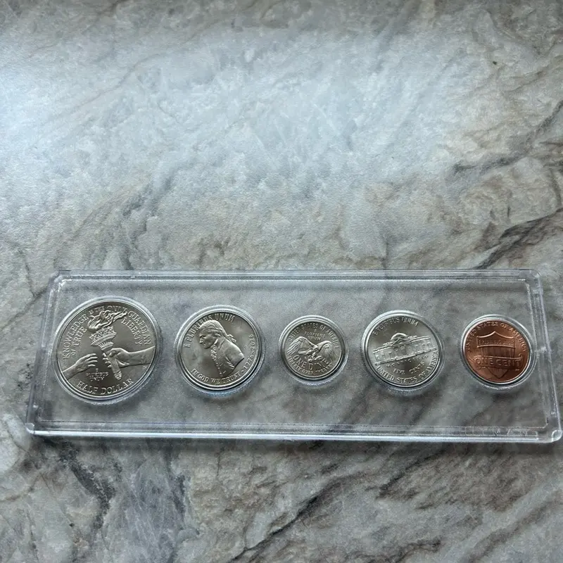 2026 Semiquincentennial 5-Coin Set - BU Half Dollar, Decleration of Independence Quarter, Dime, Nickel, and 2025 Penny in Whitman coin holder.