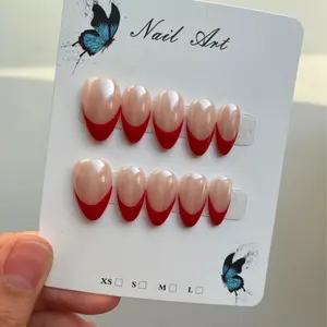 Pretty short almond and red French tip press on nails