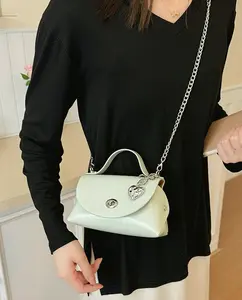 Korean-style sweet girl heart charm flip-top handbag — niche, high-end small square bag, can be carried by hand or worn on one shoulder/crossbody