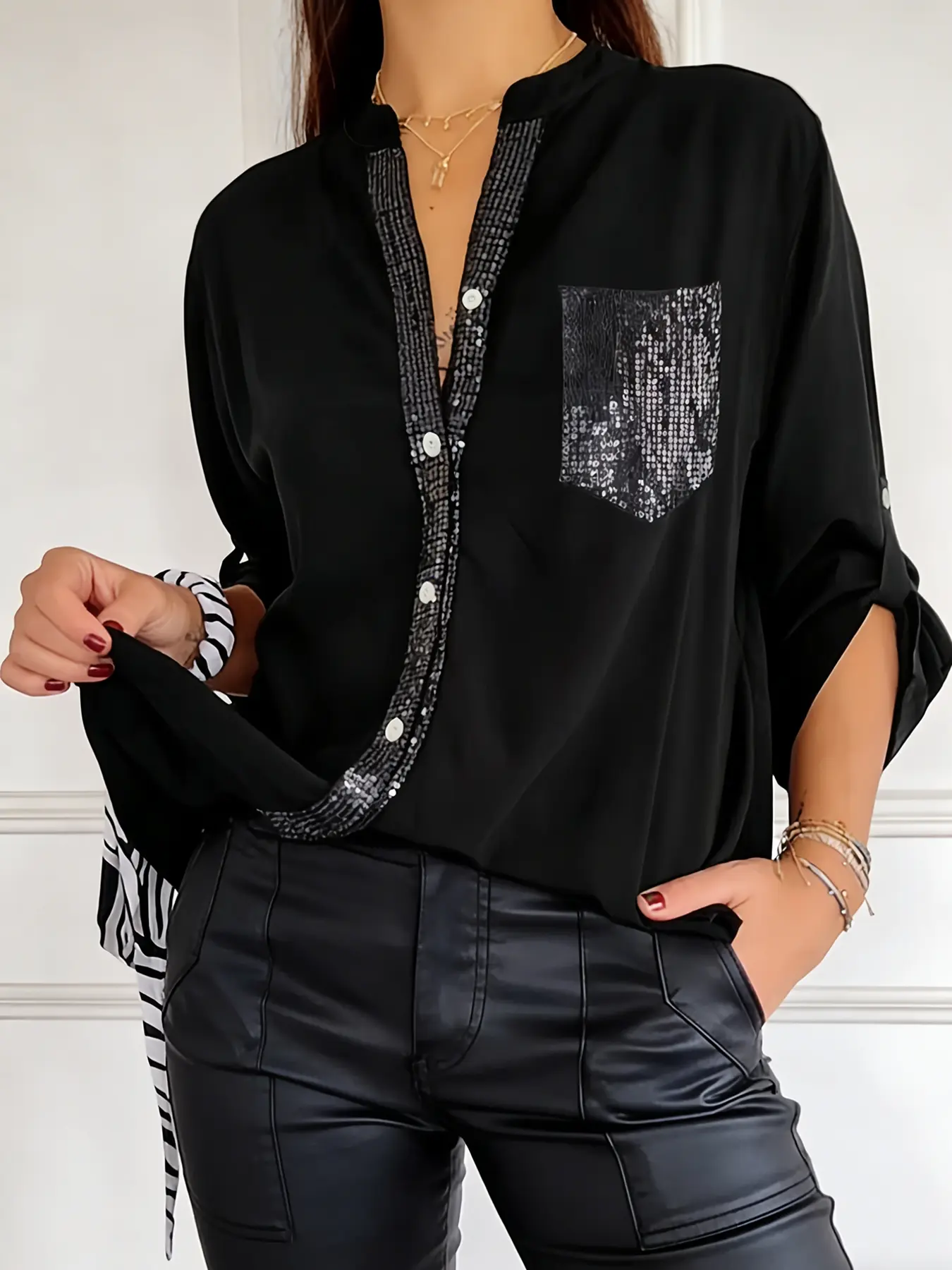 A women's black stylish sequin decorated long sleeved shirt with sequin elements, suitable for commuting to work, shopping and outdoor activities, indoor and outdoor dressing
