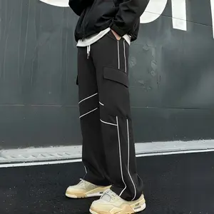 Techwear cargo pants with reflective piping — loose-fit active pants with drawstring