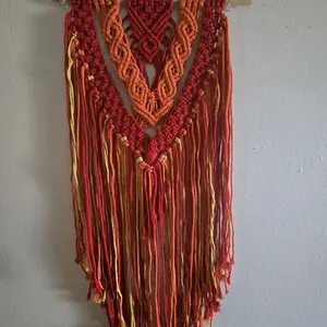 Handmade Macrame Wall Hanging - Vibrant Red & Orange Fringe Design for Boho Decor