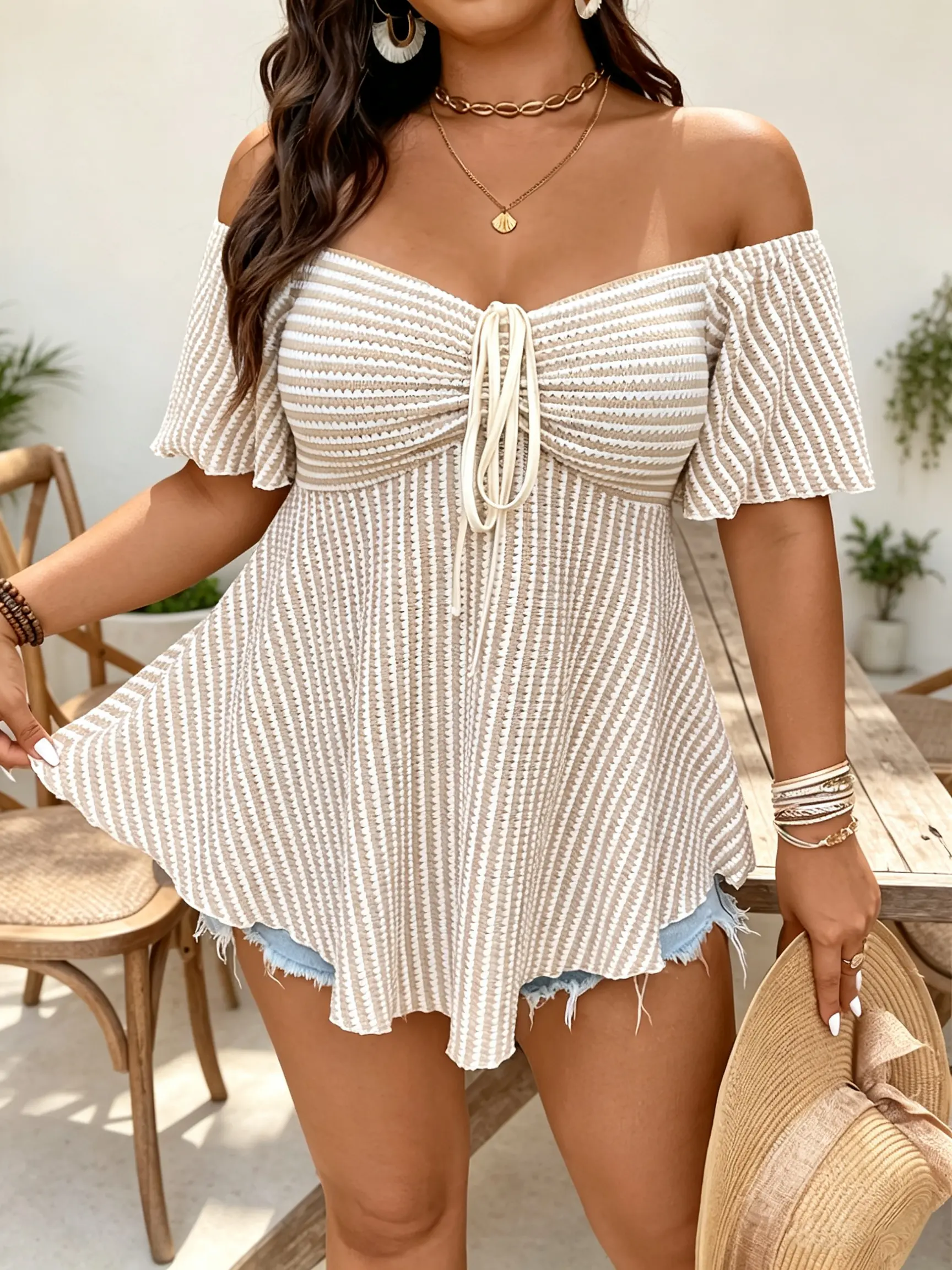 Off-the-shoulder striped knit top with tie at the chest and ruffled hem for women