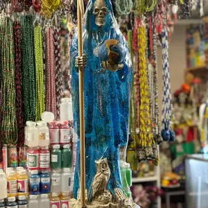 Blue Santa Muerte Statue glows in the dark with Detailed Skeleton Design and Owl Accents