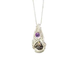 Raw andradite garnet cluster and amethyst facet wire wrapped by Frances coyne for Coynes Crystals comes with sterling silver rope chain.