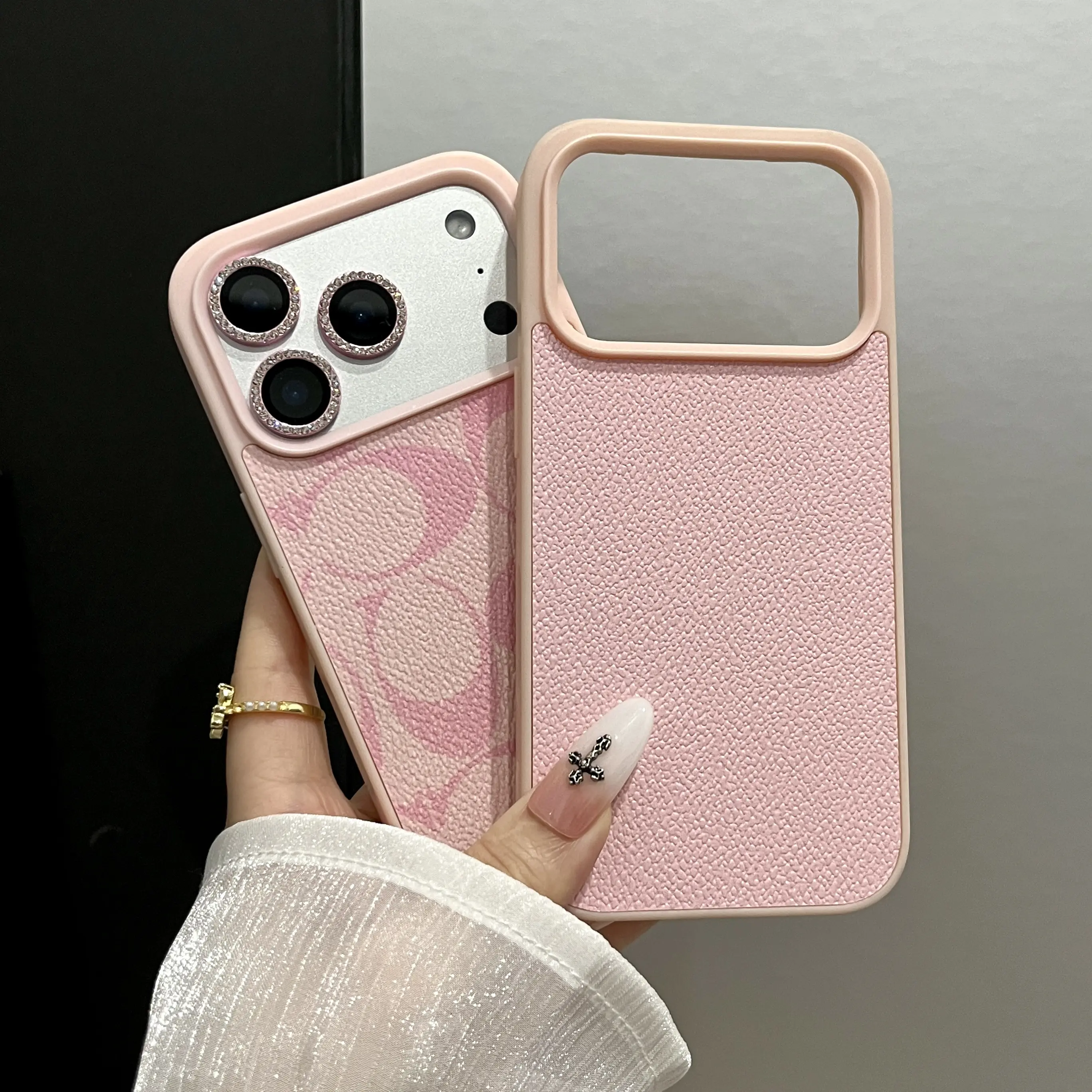 A minimalist textured phone case designed for all iPhonemodels crafted from soft faux leather It offers shock-absorbing protection and features a Letter C patternmaking it ideal for commuting or campus use