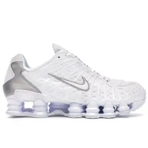 Nike Shox TL White Metallic Silver Men’s and Women’s Sneakers Full-Length Shox Cushioning Running Shoes Futuristic Design Breathable Mesh Upper Metallic Accents Comfortable Impact Absorption Athletic Footwear Streetwear Lifestyle Durable Rubber Outsole