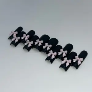 Cutesy pink bows on black press on nails