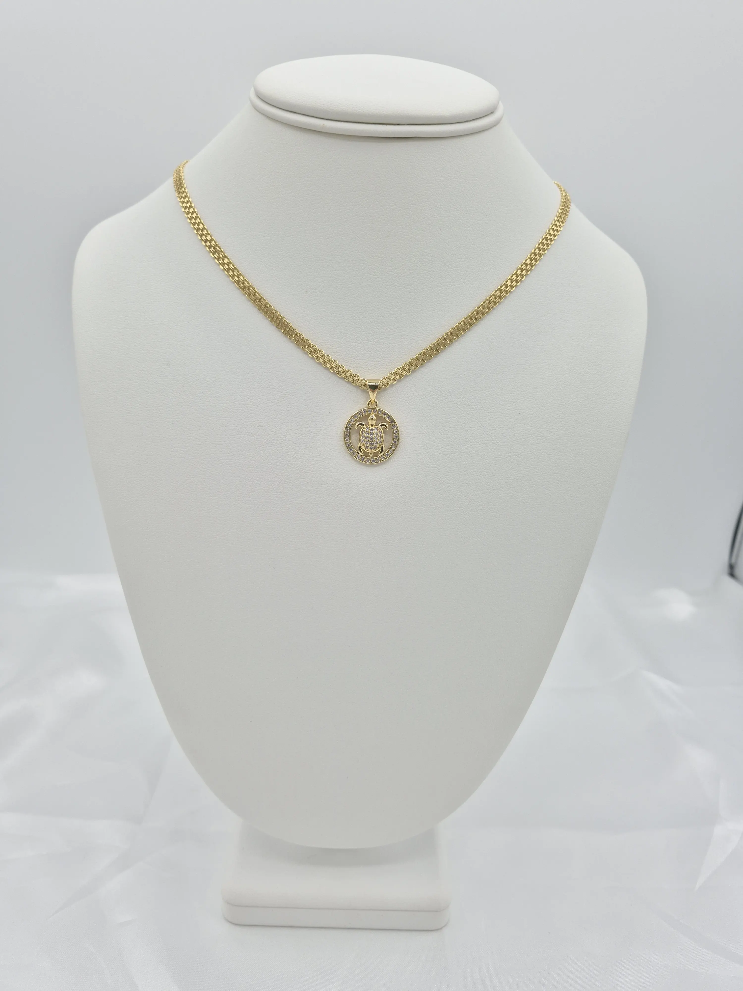 14k gold plated chain and bracelet set with turtle pendant. (89)