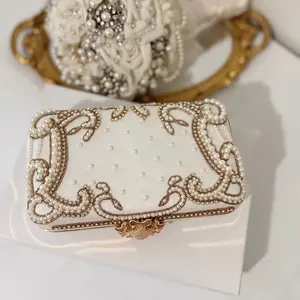 Ivory Beaded Bridal Clutch  on a premium gold frame Design..