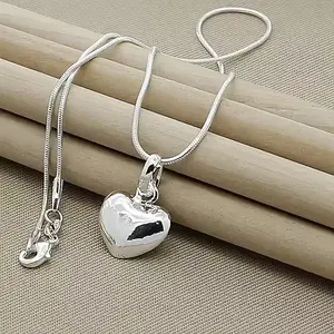 An elegant Silvery heart-shaped pendant necklace with a snake bone chain, suitable for women, a fashionable jewelry gift for weddings