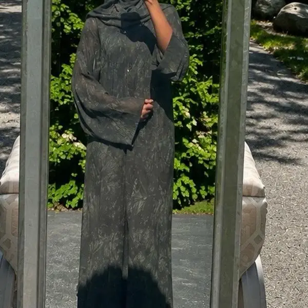 Elegant and modest printed chiffon abaya designed with a beautiful flowing silhouette and matching hijab. Available in multiple unique floral and patterned color combinations. Lightweight, flowy, and comfortable, making it perfect for everyday wear.