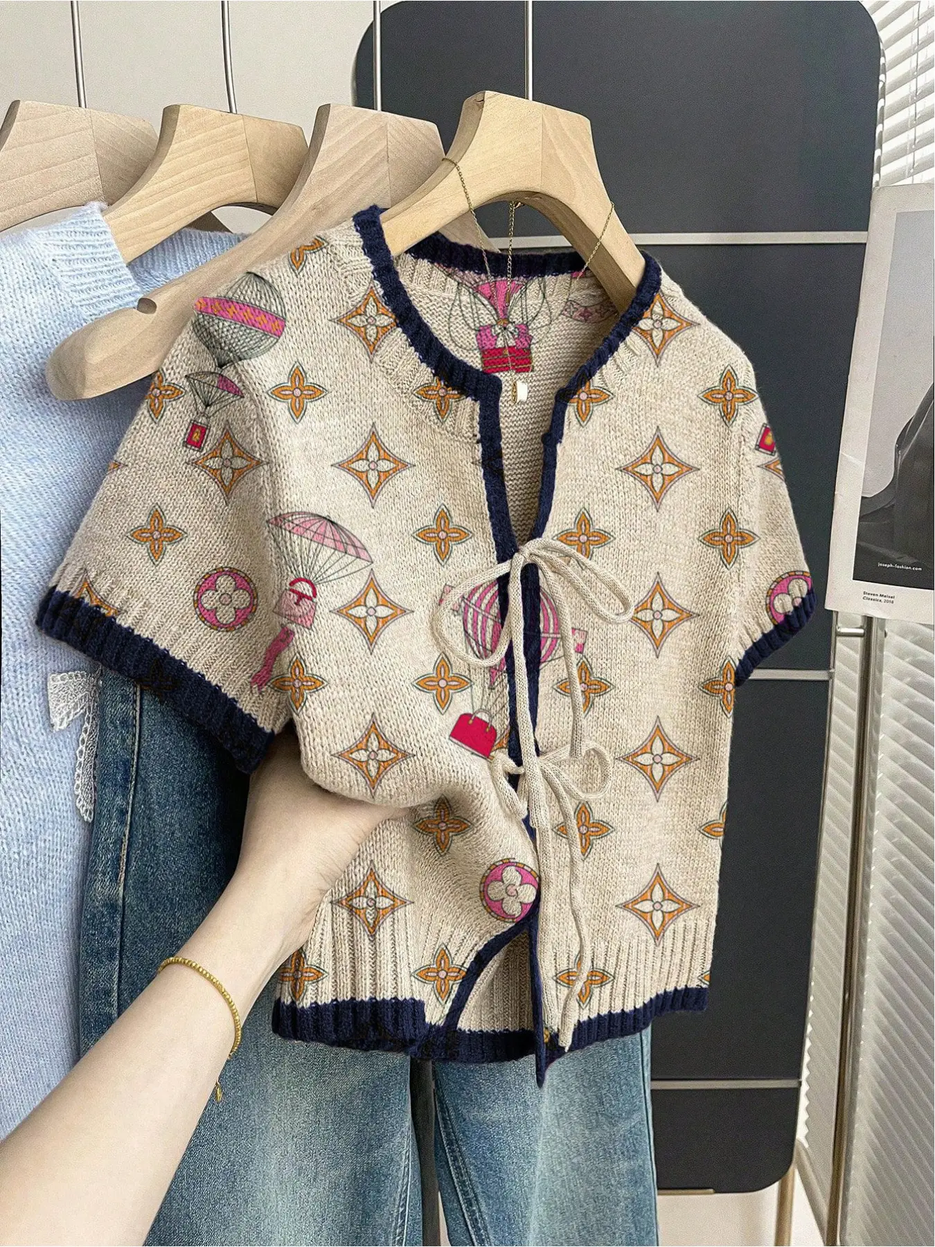 Women's khaki bohemian vacation short-sleeve knit top Boho Tie Top. Loose round neck, contrast geometric print, front tie and contrast piping. Comfortable and stylish for spring & summer casual wear.