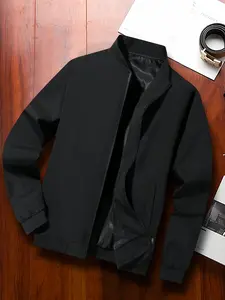 One black men’s jacket with a stand collar and zipper, urban casual style with ribbed hem and side pockets; structured fabric suitable for men’s everyday commuting and business occasions—low key, versatile, minimalist, and visually appealing. fathersdaygi