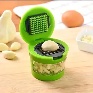 Multifunctional Garlic Press and Crusher with 2 Interchangeable Stainless Steel Blades, Manual Hand Pressure Operation, Green Plastic Reusable Kitchen Tool