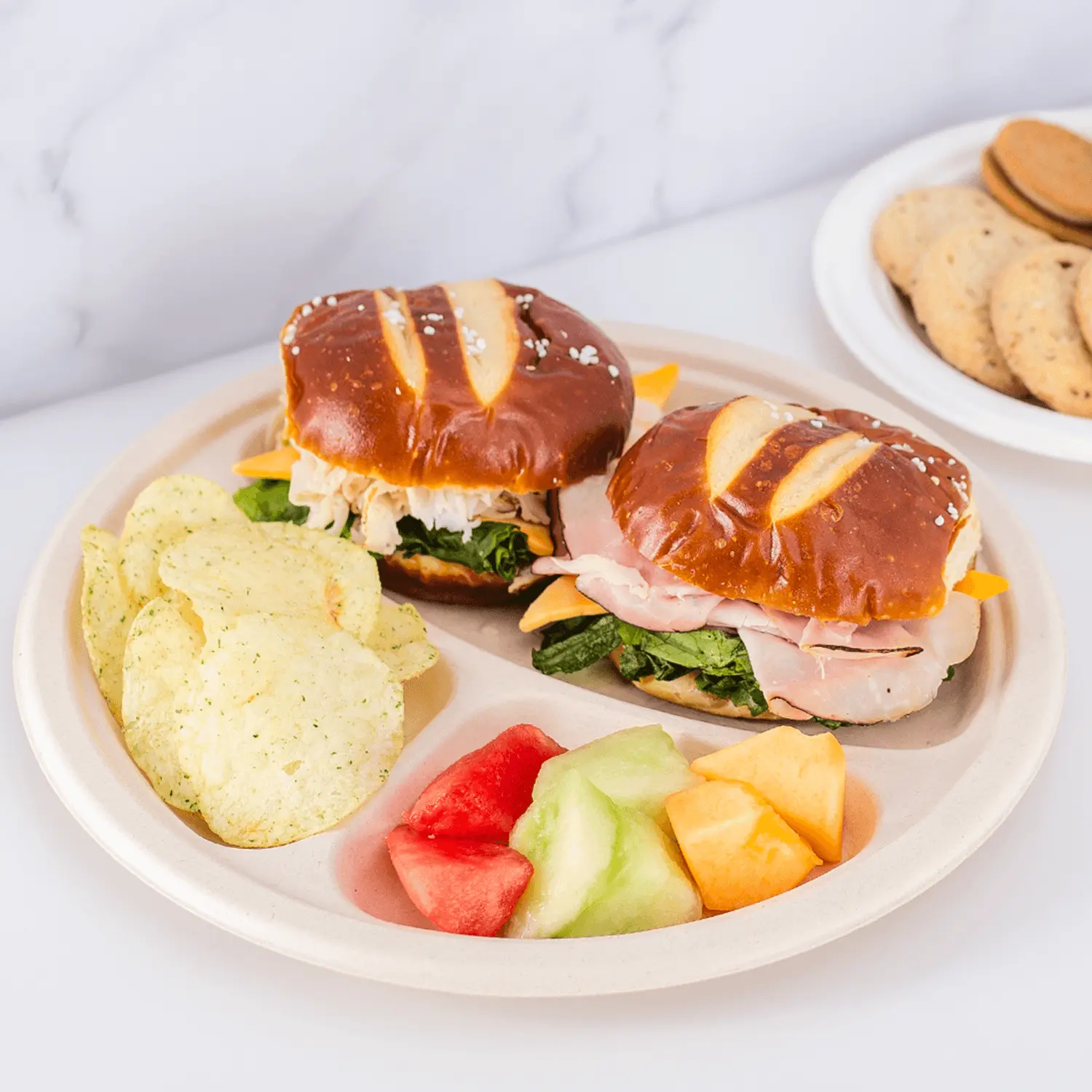 Karat Earth 10'' PFAS Free Compostable Bagasse Round Plates, Natural, 3 Compartments - 500 pcs