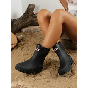 Women's mid length rain boots, waterproof rubber boots, stylish waterproof design, comfortable fit, enhanced grip, suitable for various weather conditions