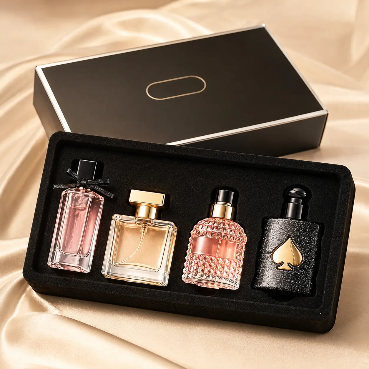 4-piece mini perfume gift set in a sleek black box. Compact bottles with elegant glass designs, ideal for gifting, travel, display, and daily carry.
