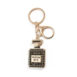 Perfume Bottle Black Bag Charm with Gold Ring and Rhinestone Accents for Stylish Accessories