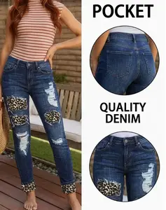 Women's Mid-rise Skinny Jeans with leopard print patch and ripped details. Dark wash stretch fabric to accentuate your curves, featuring a trendy street and casual style