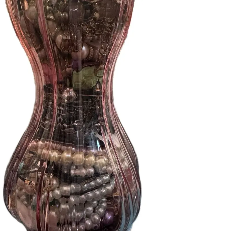Jewelry jar 560 in a beautiful pink vase