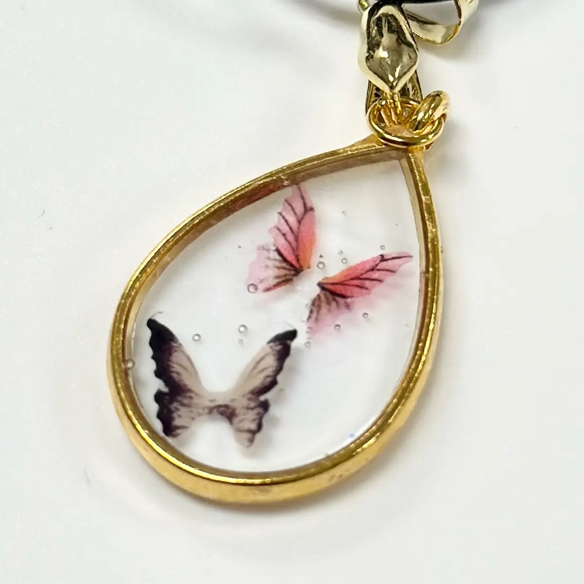 Tear Drop Clear Resin butterfly Pendant with 20 in cord