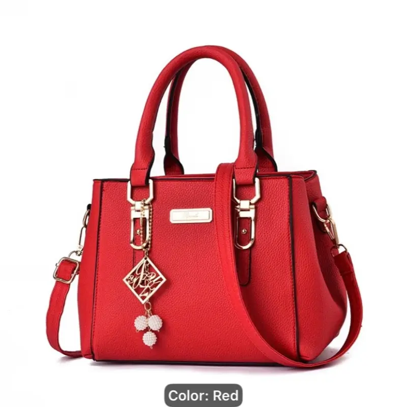 Elegant Red Handbag for Women with Gold Accents and Decorative Charm