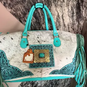 Turquoise Tooled Leather Hair on Hide Duffle Bag with Fringe and Concho
