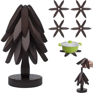 Natural Tree Trivet Set - Christmas Tree Design! This heat - resistant set includes 4 walnut - wood trivets and 1 stand, stored like a Christmas tree. A foldable kitchen decor art, perfect for pots, bowls, coffee mugs, teapots and hot pots. Gift Wooden