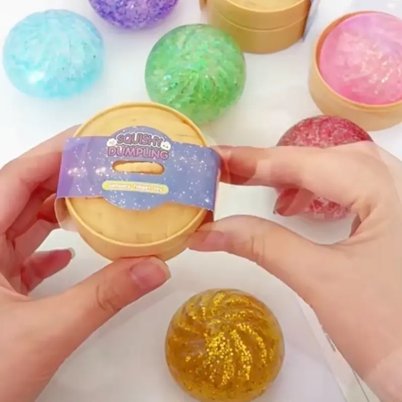 1 Glitter Dumpling Fidget Toy for Stress Relief Fun Engaging Easy to Hold Versatile On-the-Go Use Ideal for All. 5.3cm x4.5cm Filled with Beads. 1 Random Color