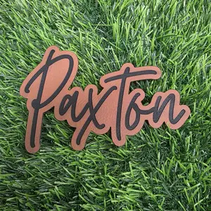 Custom name iron-on leatherette patch.