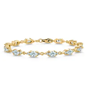 Gem Stone King 18K Yellow Gold Plated Silver Sky Blue Aquamarine and White Moissanite Tennis Bracelet For Women | 6.91 Cttw | Gemstone Birthstone | Oval 6X4MM | 6.5, 7, 7.5 Inch