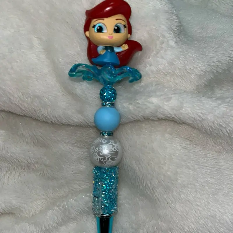 Bedazzled pens with character toppers