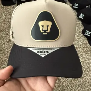 Pumas Unam Fashion Snapback Cap - Premium Quality Black and Beige Headwear, Gold Logo, Fitted Snapback Hats, Flatbill Design