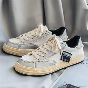 Distressed canvas sneakers with frayed raw edges, chunky lace platform shoes, vintage Y2K skate sneakers