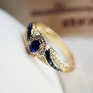 An Elegant 18K Gold-plated Copper Ring With Sapphire And Synthetic Zirconia Embellishments, Fashionable Jewelry For Everyday Wear