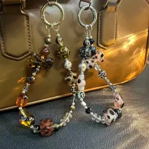 [lw] wind amber impression mobile phone chain beaded ccd camera pendant lanyard brown Maillard shell texture