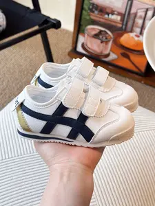 "POV: Trying to choose the perfect essential sneak for my mini-me.  Help me pick! Pure white  or the retro blue stripe ? Comment your fave below!